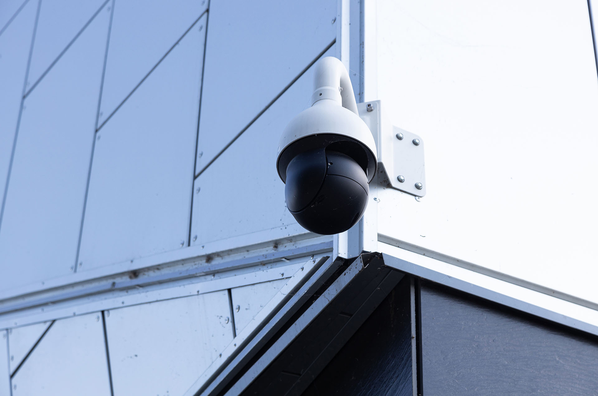 Modern CCTV camera installed on commercial building